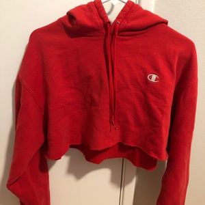 Cropped red Champion hoodie.